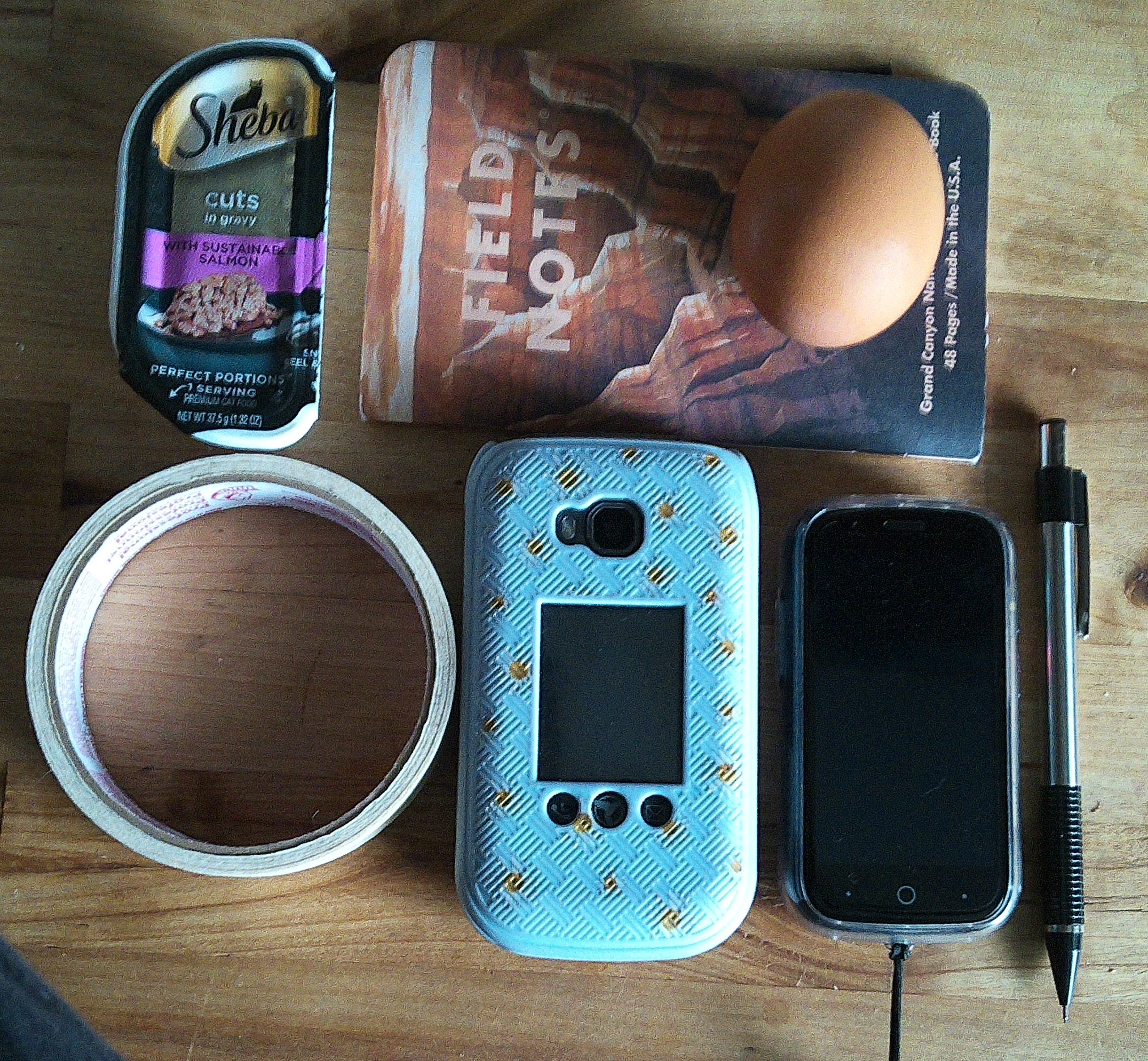 top-down view of my two phones, surrounded by random objects for scale